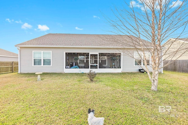 back of house featuring a yard