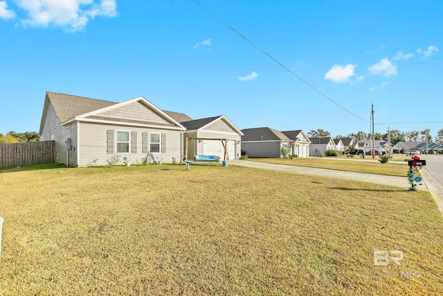 ranch-style house with a front yard and a garage