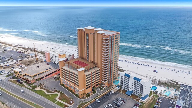 aerial view featuring a view of the beach and a water view