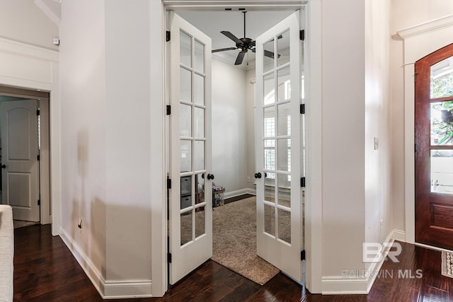 interior space with french doors, dark hardwood / wood-style flooring, ceiling fan, and crown molding