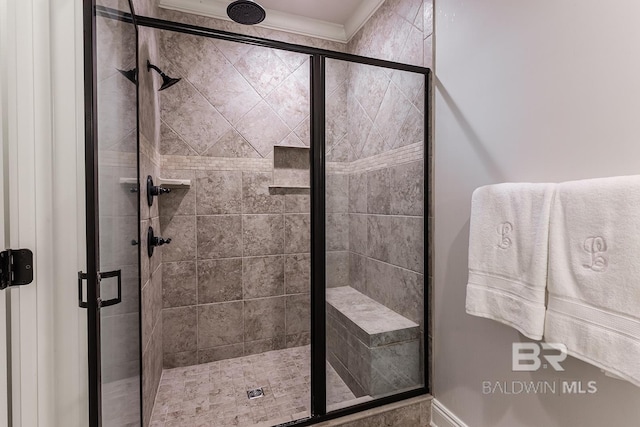 bathroom with a shower with shower door