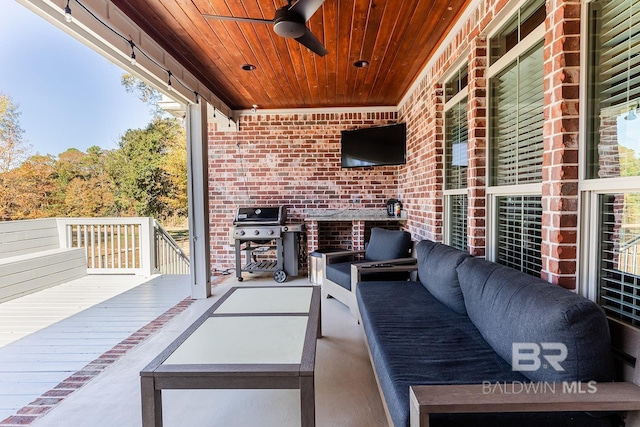 view of patio / terrace featuring outdoor lounge area, area for grilling, ceiling fan, and a deck