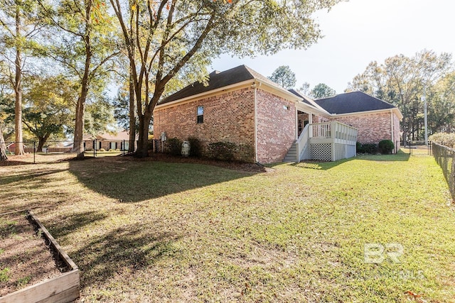 view of property exterior featuring a yard and a deck