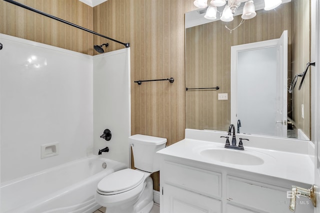 full bathroom with a notable chandelier, shower / washtub combination, vanity, and toilet