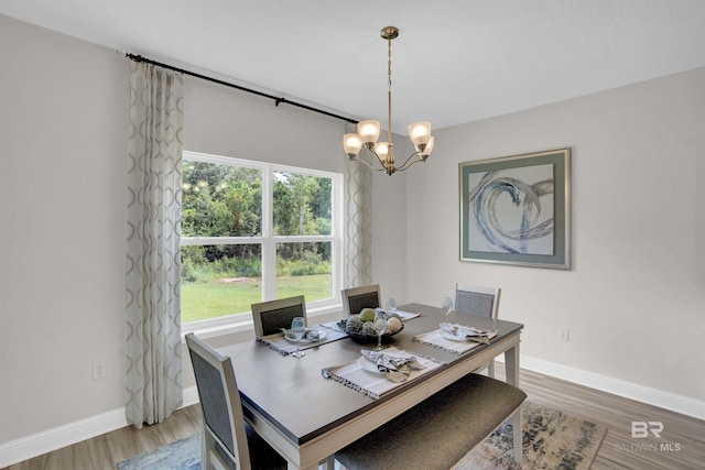 12753 Shoshoney Cir, Fairhope, AL 36532 - dining area featuring baseboards, a notable chandelier, and light wood finished floors