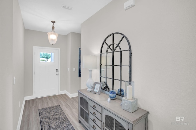 12753 Shoshoney Cir, Fairhope, AL 36532 - foyer entrance featuring visible vents, baseboards, and light wood finished floors