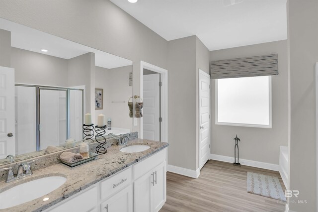 12753 Shoshoney Cir, Fairhope, AL 36532 - full bathroom with a shower stall, wood finished floors, baseboards, and a sink