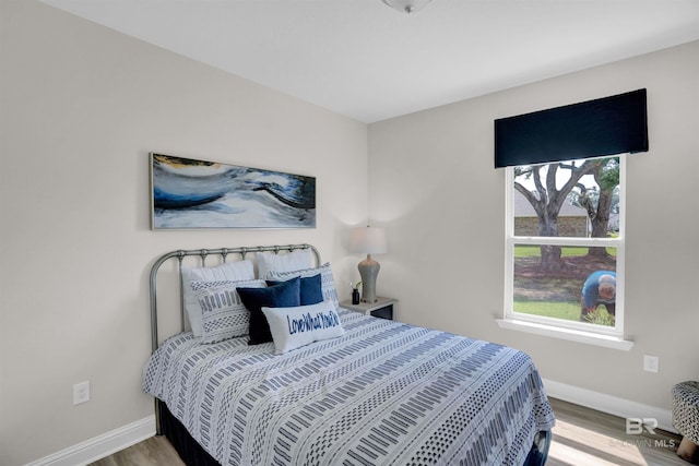 12753 Shoshoney Cir, Fairhope, AL 36532 - bedroom featuring baseboards and wood finished floors