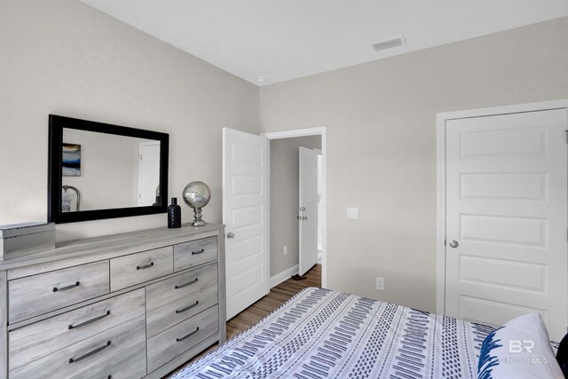 12753 Shoshoney Cir, Fairhope, AL 36532 - bedroom with visible vents and wood finished floors