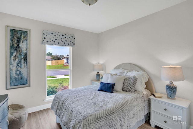 12753 Shoshoney Cir, Fairhope, AL 36532 - bedroom with light wood-style flooring and baseboards
