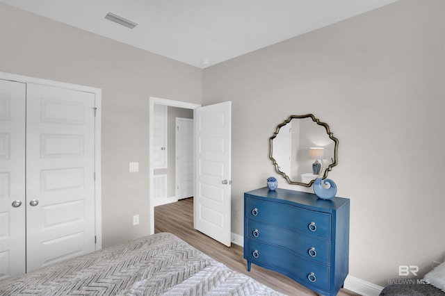 12753 Shoshoney Cir, Fairhope, AL 36532 - bedroom featuring wood finished floors, visible vents, and baseboards
