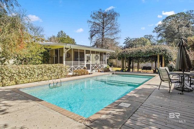 view of pool featuring a sunroom