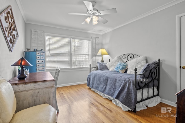 bedroom with ornamental molding, light hardwood / wood-style floors, and ceiling fan