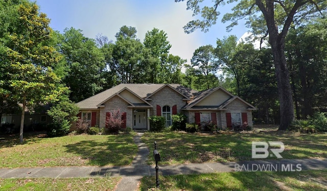 craftsman-style home with a front lawn