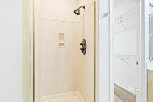 13 Bugle Retreat, Spanish Fort, AL 36527 - bathroom featuring a shower stall, a spacious closet, vanity, and wood finished floors