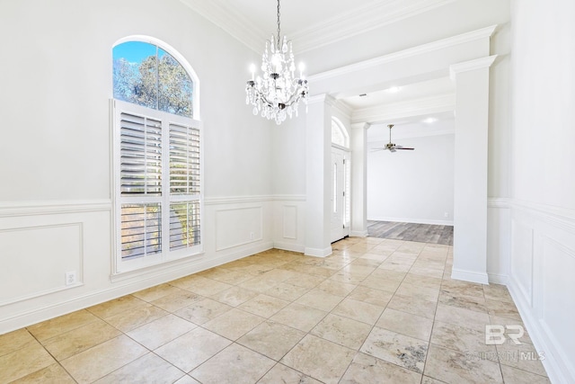 unfurnished dining area with ceiling fan with notable chandelier and ornamental molding