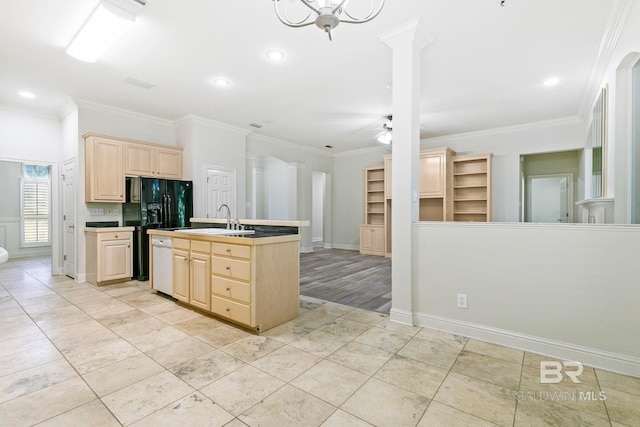 kitchen featuring ceiling fan, light brown cabinets, sink, and crown molding