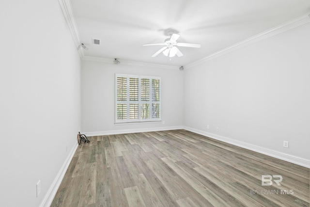 unfurnished room with crown molding, ceiling fan, and light hardwood / wood-style floors