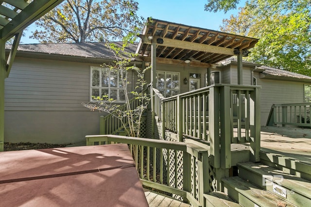 exterior space with ceiling fan and a wooden deck