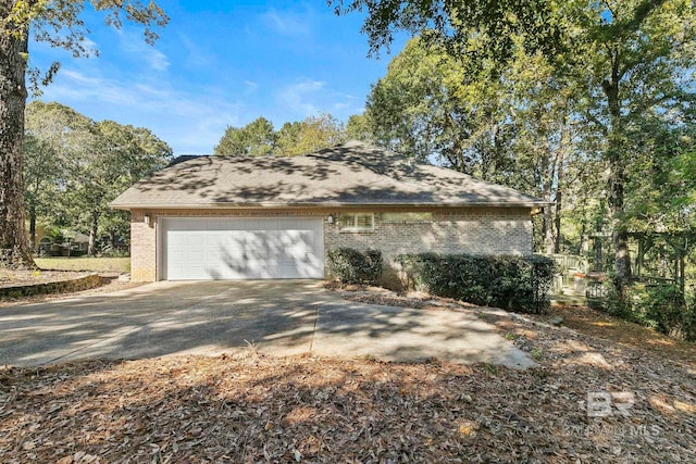 13 Bugle Retreat, Spanish Fort, AL 36527 - view of side of property featuring a garage, brick siding, and concrete driveway