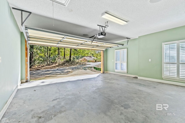 13 Bugle Retreat, Spanish Fort, AL 36527 - garage with a garage door opener and baseboards