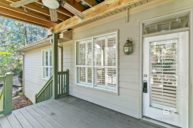 wooden deck featuring ceiling fan