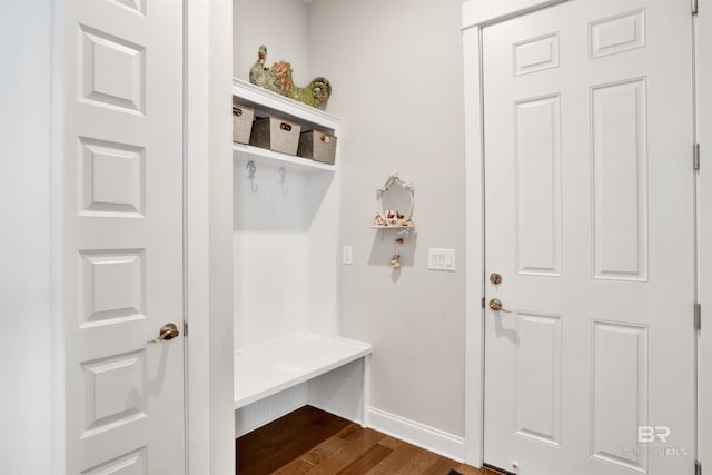 mudroom featuring dark wood-style floors and baseboards