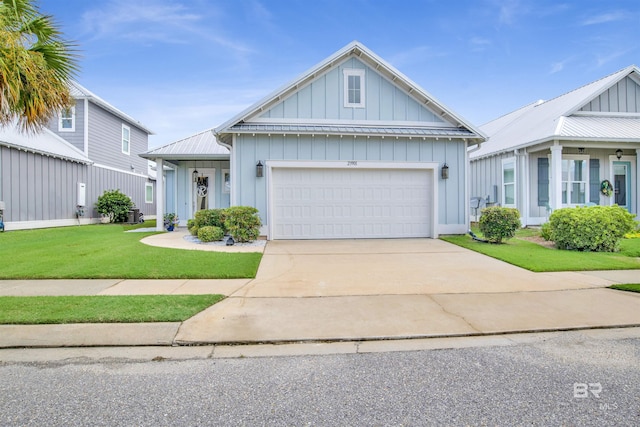 modern inspired farmhouse with an attached garage, board and batten siding, metal roof, driveway, and a front lawn