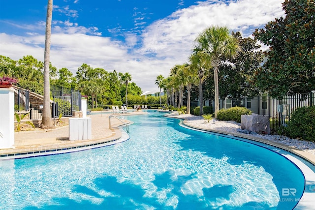 community pool featuring fence