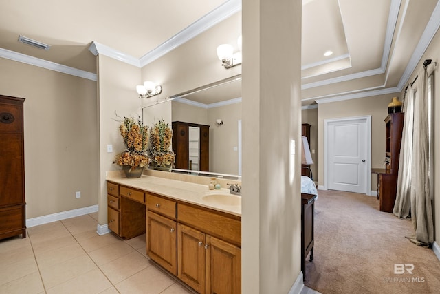 bathroom with ornamental molding, tile patterned flooring, and vanity