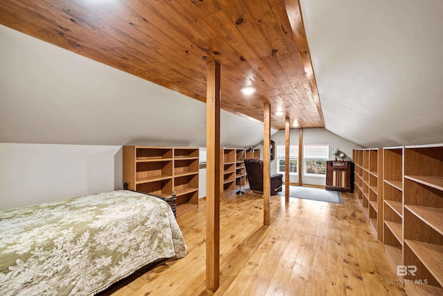 bedroom featuring lofted ceiling, hardwood / wood-style floors, and wood ceiling