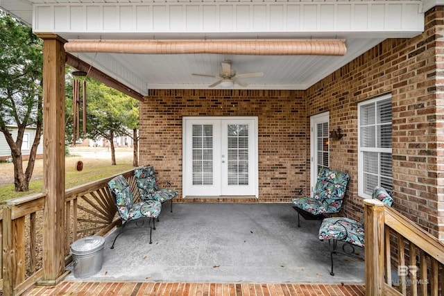 wooden deck featuring a patio area, french doors, and ceiling fan