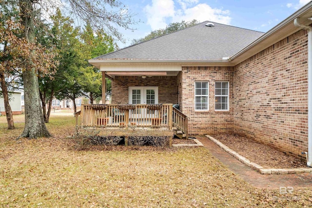 back of property featuring a deck