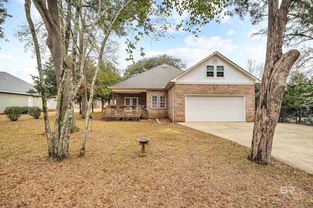 view of front of home with a garage and a deck