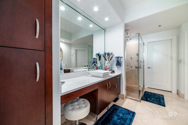 bathroom with a stall shower, tile patterned flooring, vanity, and recessed lighting