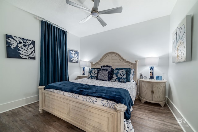 bedroom featuring baseboards, ceiling fan, and wood finished floors
