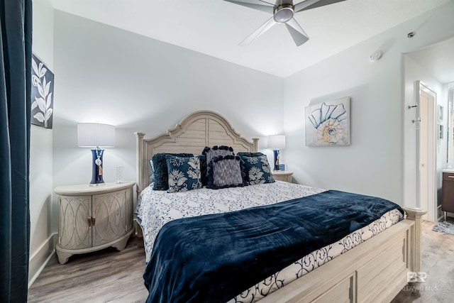 bedroom featuring baseboards, a ceiling fan, and wood finished floors
