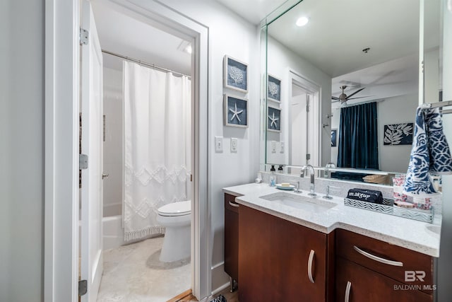 bathroom with toilet, vanity, shower / tub combo with curtain, tile patterned floors, and a ceiling fan