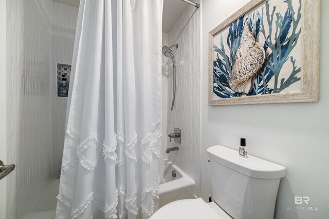 full bath with toilet and shower / bath combination with curtain