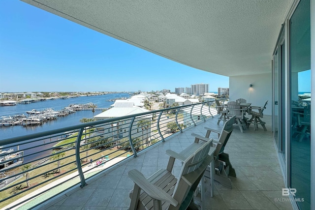 balcony featuring a water view