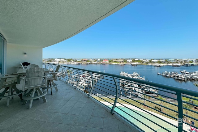 balcony featuring a water view