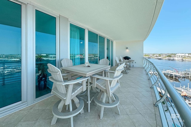 balcony featuring a water view