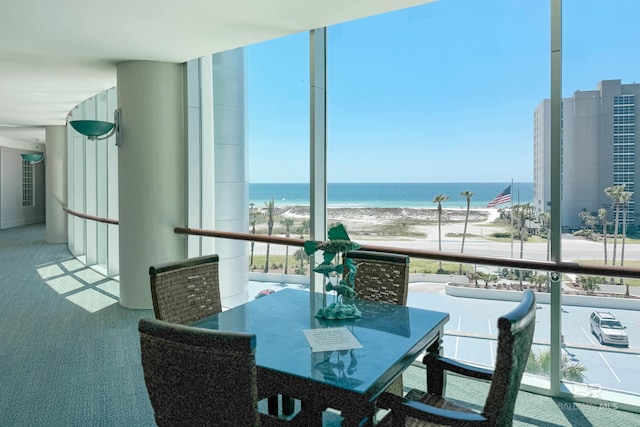 balcony with a view of the beach and a water view