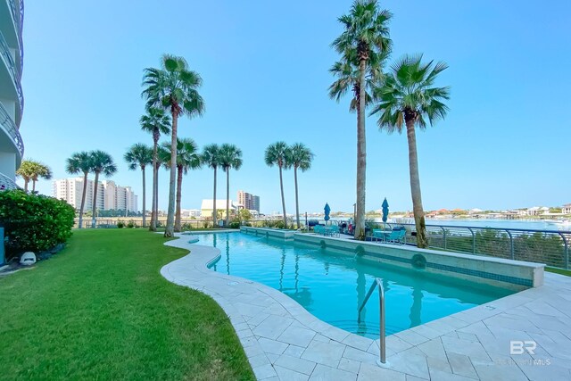 community pool featuring a yard