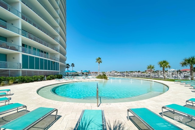 community pool with a patio