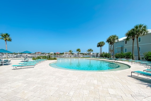 community pool with a patio