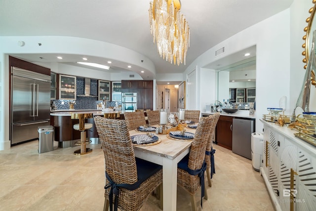 dining area featuring recessed lighting, a notable chandelier, visible vents, and light tile patterned flooring