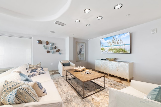 living area with visible vents and recessed lighting