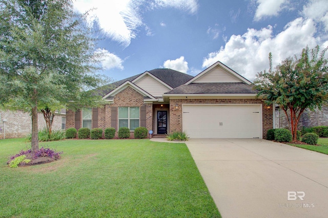 view of front of house featuring a front yard and a garage