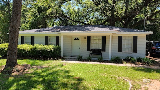 509 Pine St, Daphne, AL 36526 - single story home with brick siding, a porch, and a front lawn